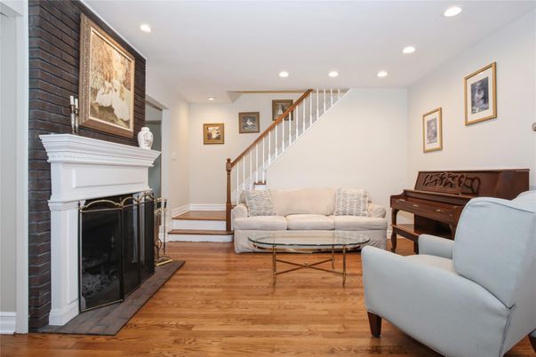 Fireplace, Interior, Living room, Piano, Recessed Lighting, Wood Texture Flooring
