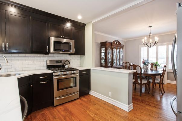Chandelier, Dining room, Interior, Kitchen, Recessed Lighting, Stainless Steel Appliances, Wood Texture Flooring