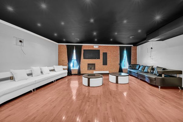Fireplace, Interior, Living room, Recessed Lighting, Stone Walls, Wood Texture Flooring