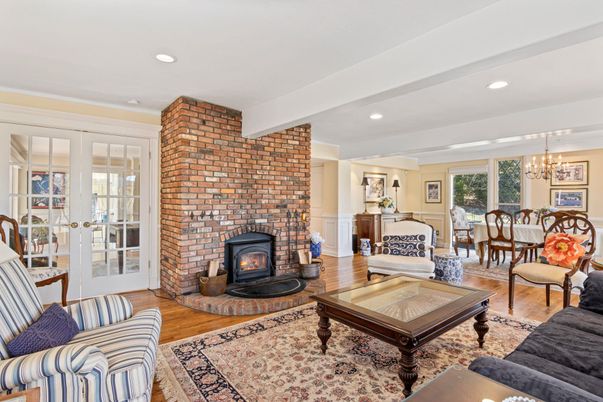 Chandelier, Dining room, Fireplace, Interior, Living room, Recessed Lighting, Stone Walls, Wood Texture Flooring