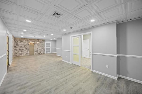 Empty room, Interior, Recessed Lighting, Stone Walls, Wood Texture Flooring