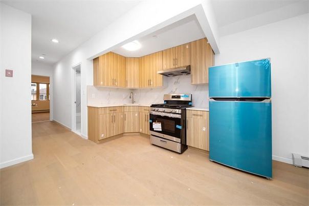 Interior, Kitchen, Marble Walls, Recessed Lighting, Stainless Steel Appliances, Wood Texture Flooring