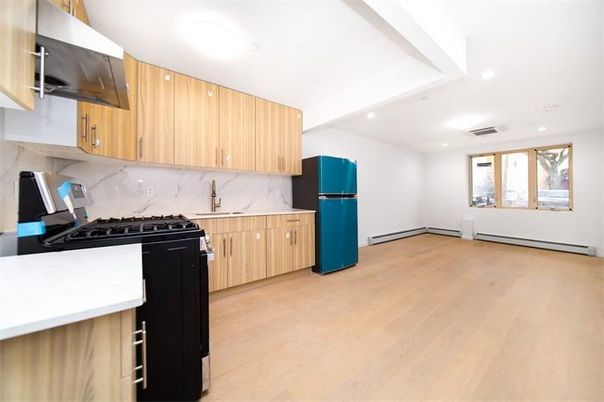Interior, Kitchen, Marble Walls, Recessed Lighting, Stainless Steel Appliances, Wood Texture Flooring