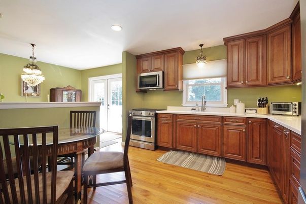 Chandelier, Dining room, Interior, Kitchen, Pendant Lights, Recessed Lighting, Stainless Steel Appliances, Wood Texture Flooring