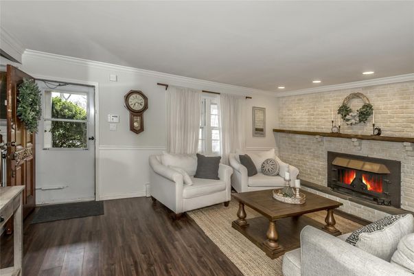 Fireplace, Interior, Living room, Recessed Lighting, Stone Walls, Wood Texture Flooring