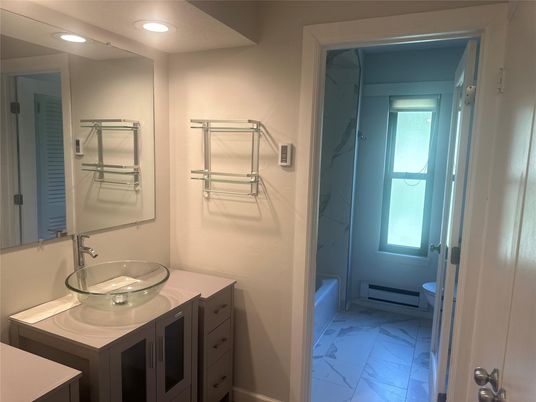 Bathroom, Dual Sink Vanities, Interior, Marble, Marble Walls, Recessed Lighting