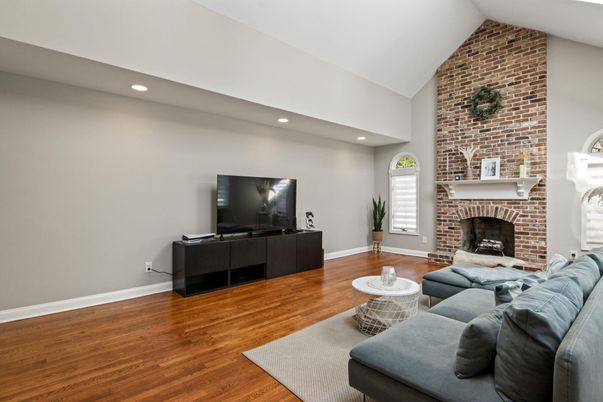 Fireplace, Interior, Living room, Recessed Lighting, Stone Walls, Wood Texture Flooring