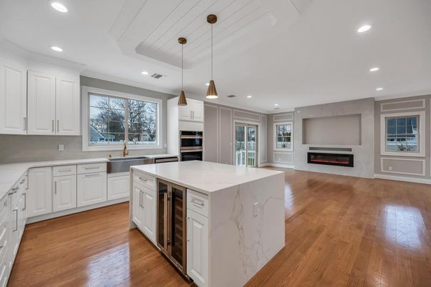 Fireplace, Interior, Kitchen, Pendant Lights, Recessed Lighting, Stainless Steel Appliances, Wood Texture Flooring