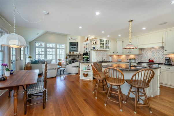 Dining room, Fireplace, Interior, Kitchen, Living room, Pendant Lights, Recessed Lighting, Stainless Steel Appliances, Wood Texture Flooring