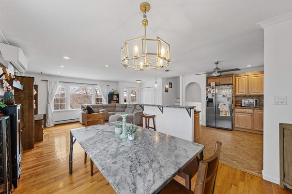 Dining room, Interior, Kitchen, Living room, Pendant Lights, Recessed Lighting, Stainless Steel Appliances, Wood Texture Flooring