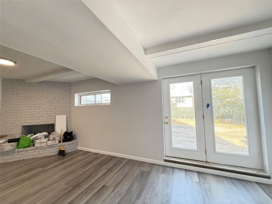 Empty room, Fireplace, Interior, Recessed Lighting, Stone Walls, Wood Texture Flooring