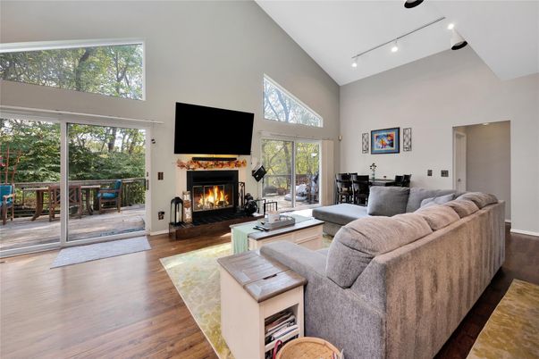 Dining room, Fireplace, Interior, Living room, Recessed Lighting, Wood Texture Flooring