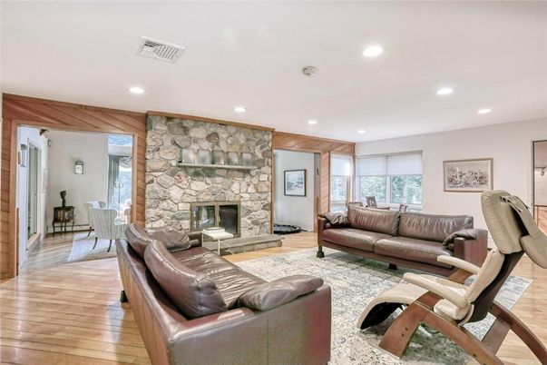 Fireplace, Interior, Living room, Recessed Lighting, Stone Walls, Wood Texture Flooring