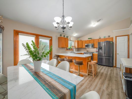 Chandelier, Dining room, Interior, Kitchen, Stainless Steel Appliances, Wood Texture Flooring