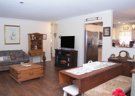 Fireplace, Interior, Kitchen, Living room, Recessed Lighting, Stainless Steel Appliances, Wood Texture Flooring