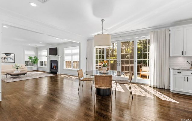 Dining room, Fireplace, Interior, Living room, Pendant Lights, Recessed Lighting, Wood Texture Flooring