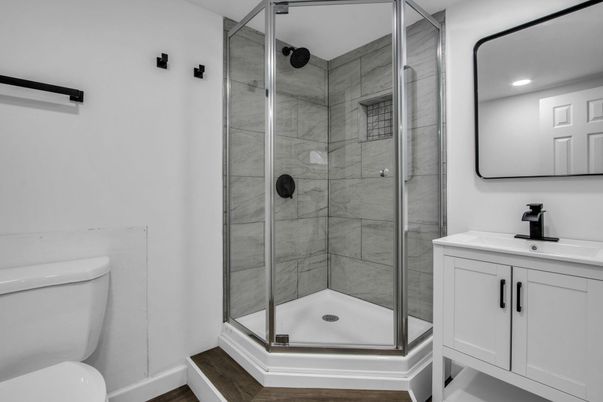 Bathroom, Glass Shower, Interior, Marble Walls, Recessed Lighting, Wood Texture Flooring