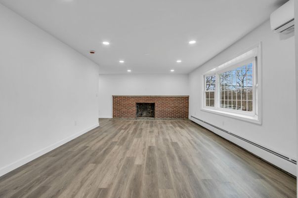 Empty room, Fireplace, Interior, Recessed Lighting, Stone Walls, Wood Texture Flooring