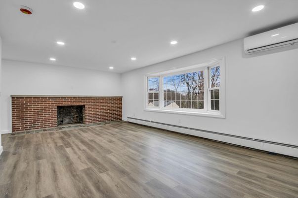 Empty room, Fireplace, Interior, Recessed Lighting, Stone Walls, Wood Texture Flooring