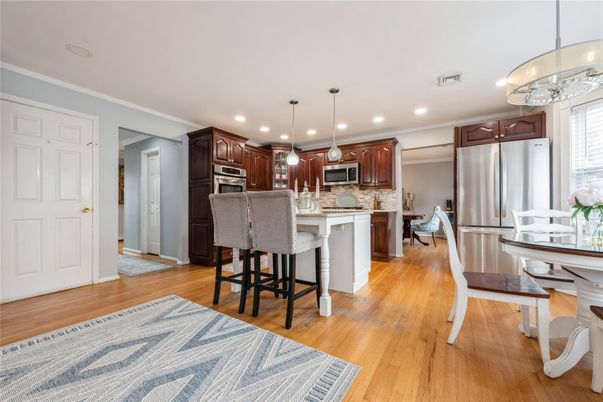 Dining room, Interior, Kitchen, Pendant Lights, Recessed Lighting, Stainless Steel Appliances, Wood Texture Flooring