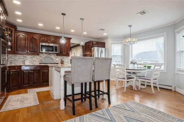Dining room, Interior, Kitchen, Pendant Lights, Recessed Lighting, Stainless Steel Appliances, Wood Texture Flooring