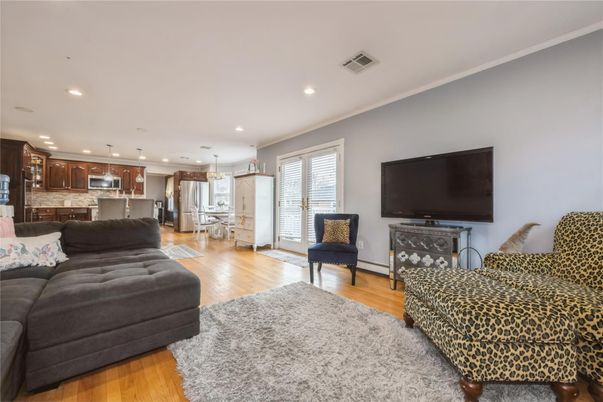 Dining room, Interior, Kitchen, Living room, Pendant Lights, Recessed Lighting, Stainless Steel Appliances, Wood Texture Flooring