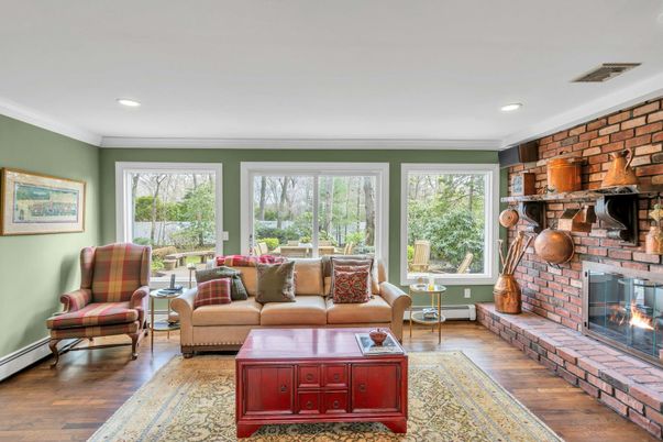 Fireplace, Interior, Living room, Recessed Lighting, Stone Walls, Wood Texture Flooring