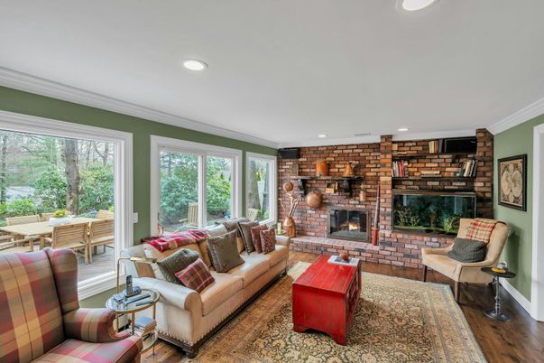 Fireplace, Interior, Living room, Recessed Lighting, Stone Walls, Wood Texture Flooring