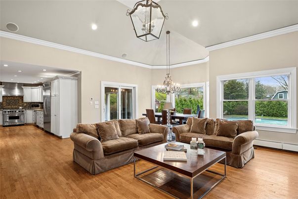 Chandelier, Dining room, Interior, Kitchen, Living room, Recessed Lighting, Stainless Steel Appliances, Wood Texture Flooring