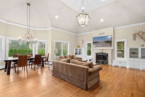 Chandelier, Dining room, Fireplace, Interior, Living room, Pendant Lights, Recessed Lighting, Wood Texture Flooring