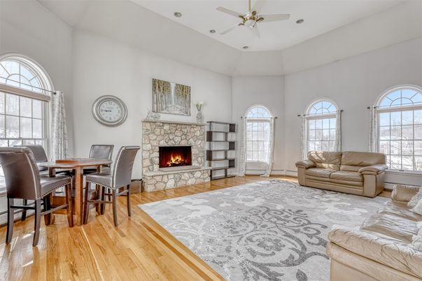 Dining room, Fireplace, Interior, Living room, Recessed Lighting, Wood Texture Flooring