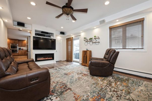 Fireplace, Interior, Kitchen, Living room, Recessed Lighting, Stainless Steel Appliances, Wood Texture Flooring