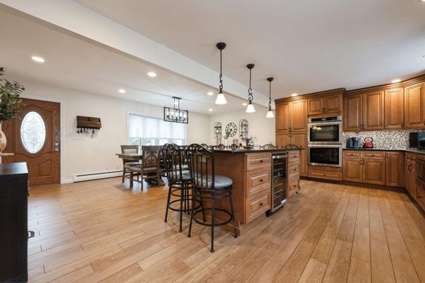 Dining room, Interior, Kitchen, Pendant Lights, Recessed Lighting, Stainless Steel Appliances, Wood Texture Flooring