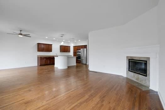 Empty room, Fireplace, Interior, Kitchen, Pendant Lights, Recessed Lighting, Wood Texture Flooring