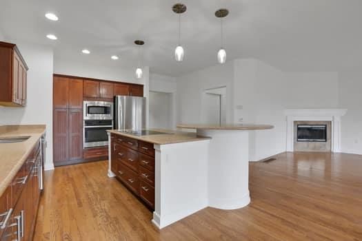 Fireplace, Interior, Kitchen, Pendant Lights, Recessed Lighting, Stainless Steel Appliances, Wood Texture Flooring