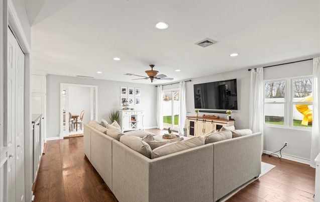Dining room, Fireplace, Interior, Living room, Recessed Lighting, Wood Texture Flooring