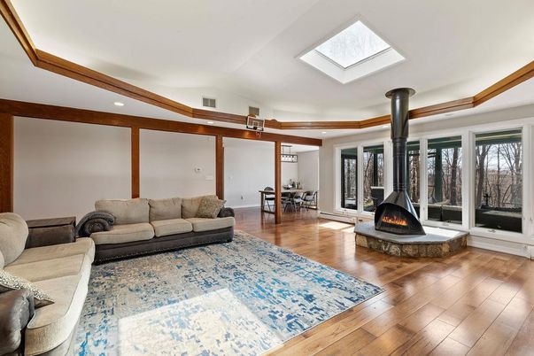 Dining room, Fireplace, Interior, Living room, Recessed Lighting, Wood Texture Flooring