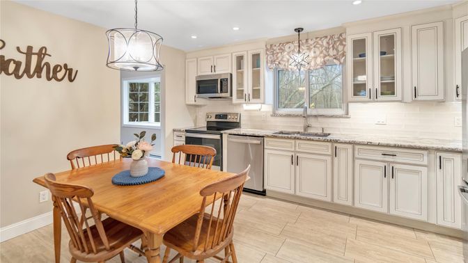 Dining room, Interior, Kitchen, Pendant Lights, Recessed Lighting, Stainless Steel Appliances, Wood Texture Flooring