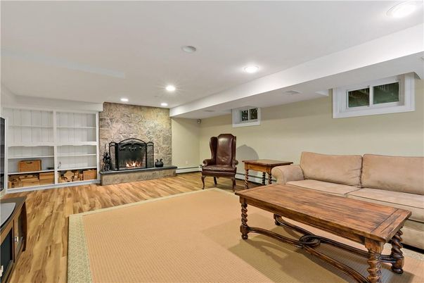 Fireplace, Interior, Living room, Recessed Lighting, Stone Walls, Wood Texture Flooring