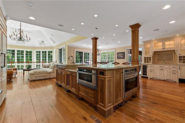Chandelier, Interior, Kitchen, Living room, Recessed Lighting, Stainless Steel Appliances, Wood Texture Flooring