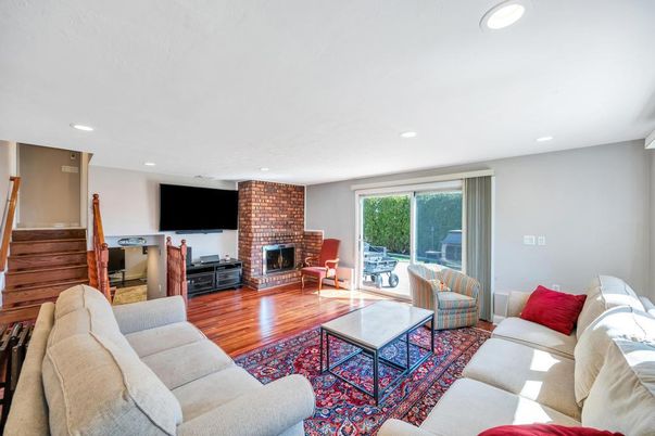 Fireplace, Interior, Living room, Recessed Lighting, Stone Walls, Wood Texture Flooring