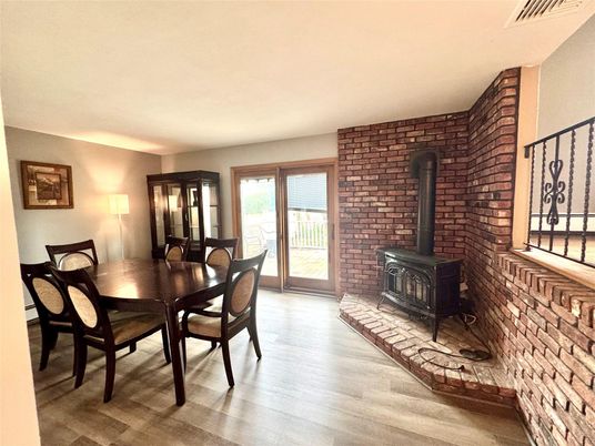 Dining room, Fireplace, Interior, Stone Walls, Wood Texture Flooring