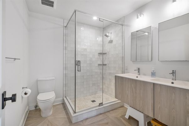 Bathroom, Dual Sink Vanities, Glass Shower, Interior, Recessed Lighting, Wood Texture Flooring