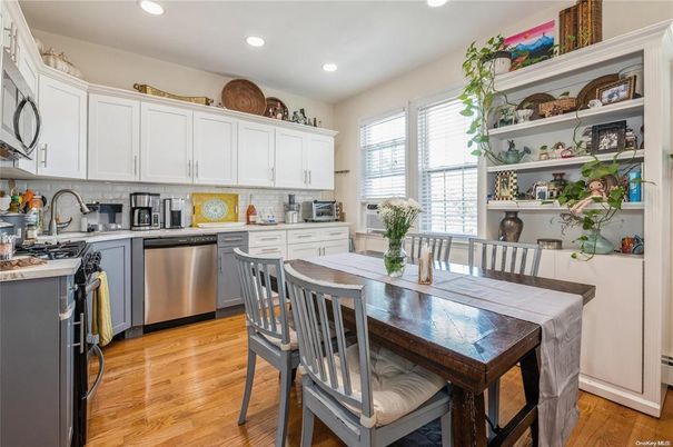 Dining room, Interior, Kitchen, Recessed Lighting, Stainless Steel Appliances, Wood Texture Flooring