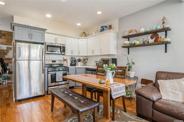 Dining room, Interior, Kitchen, Recessed Lighting, Stainless Steel Appliances, Wood Texture Flooring