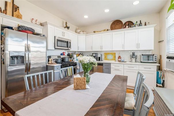 Dining room, Interior, Kitchen, Recessed Lighting, Stainless Steel Appliances, Wood Texture Flooring