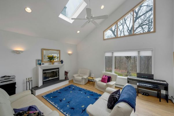 Fireplace, Interior, Living room, Piano, Recessed Lighting, Wood Texture Flooring