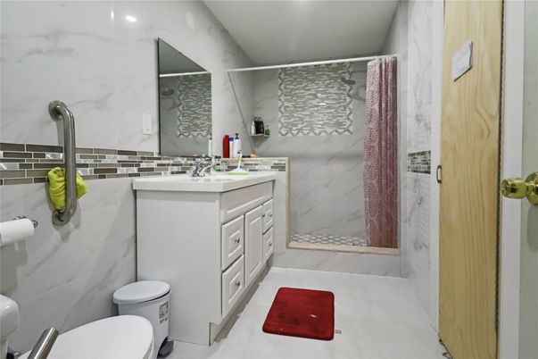 Bathroom, Dual Sink Vanities, Interior, Marble Walls, Recessed Lighting