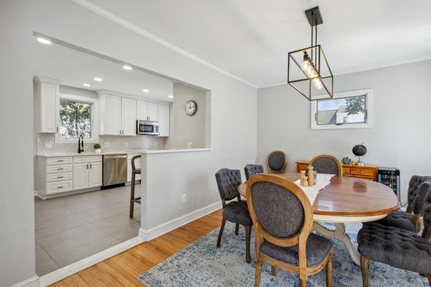 Dining room, Interior, Kitchen, Pendant Lights, Recessed Lighting, Stainless Steel Appliances, Wood Texture Flooring