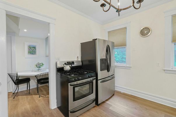 Chandelier, Dining room, Interior, Kitchen, Recessed Lighting, Stainless Steel Appliances, Wood Texture Flooring